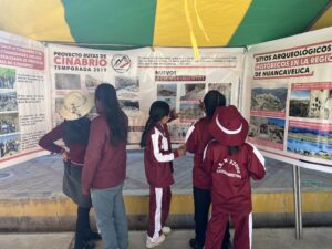 children looking at a photo exhibit