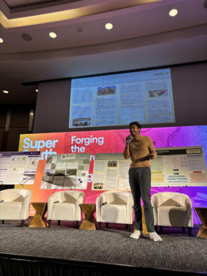 Devan Wiley, BA’25, presenting at the Super South Summit.