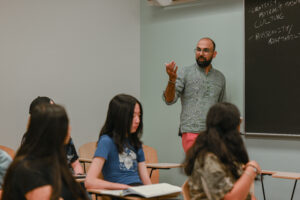 A photo of a Vanderbilt faculty member teaching students during a seminar pilot course.