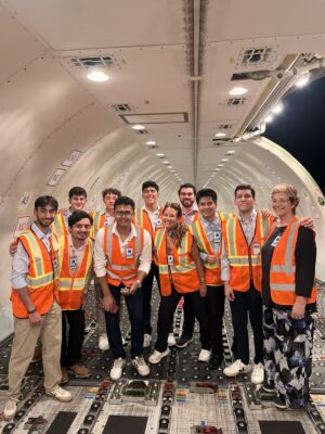 A photo of students inside a DHL cargo plane.